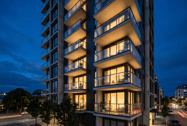 Glass balconies and frameless railings on a residential tower
