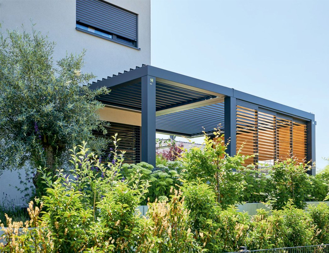 LATVERA Catalog, page 8: A louvered pergola in a landscaped residential garden.