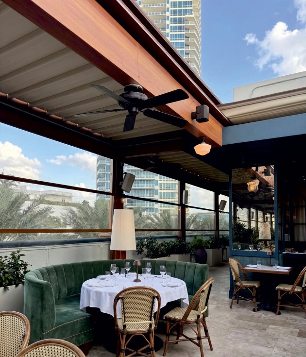 LATVERA Catalog, page 24: A restaurant terrace with glazed perimeter and roof systems.