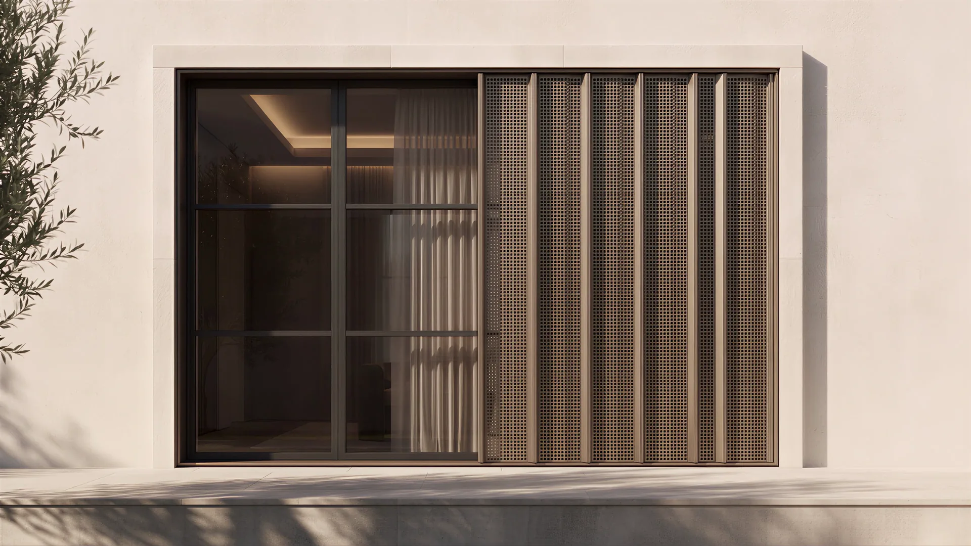 The same material concept as a perforated screen: interior light showing through the bronze panel